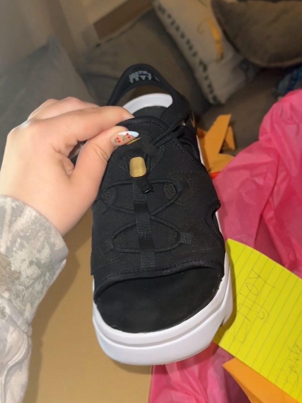 Nike Black Slip-On Sandal with Gold Toggle and White Sole